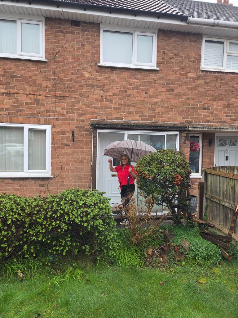 Julie O'Regan collecting keys to her first renovation